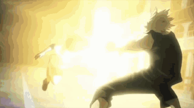 a man is fighting another man in a dark room with a light coming out of his hands .