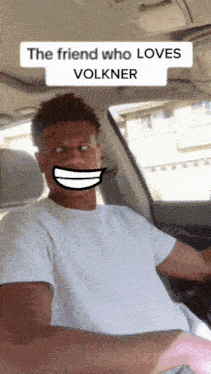 a man in a car with a fake smile on his face and the words " the friend who loves volkner "