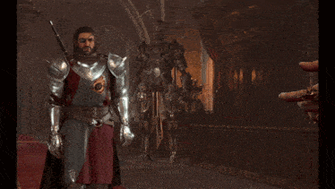 a man in armor is talking to a man in a black coat