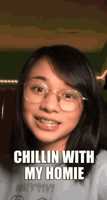 a girl with glasses says chillin with my homie on the bottom