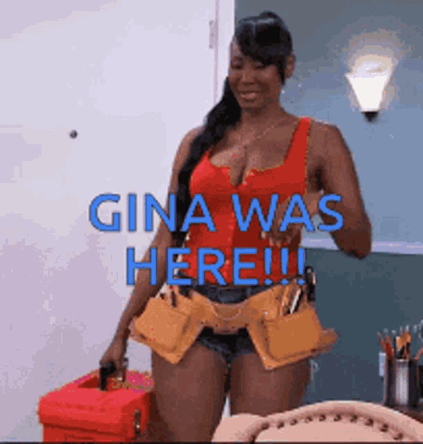 a woman in a red tank top is holding a tool belt around her waist and says gina was here !!