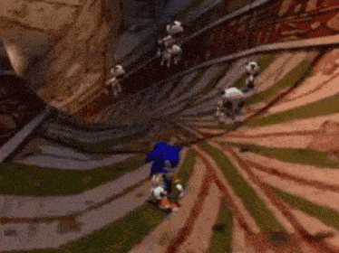 sonic the hedgehog is riding a skateboard down a spiral ramp in a video game
