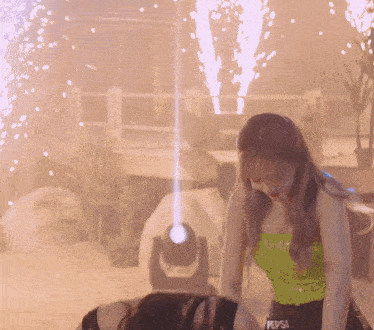a woman in a green pepsi tank top