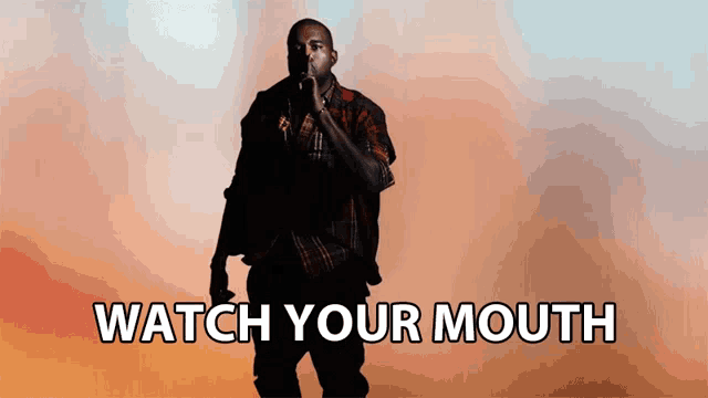 a man singing into a microphone with the words watch your mouth written below him
