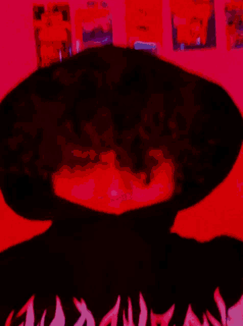 a person wearing a black shirt with flames on the front
