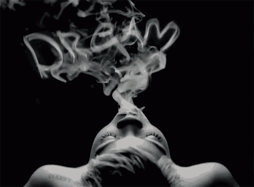 a woman smoking with smoke coming out of her mouth