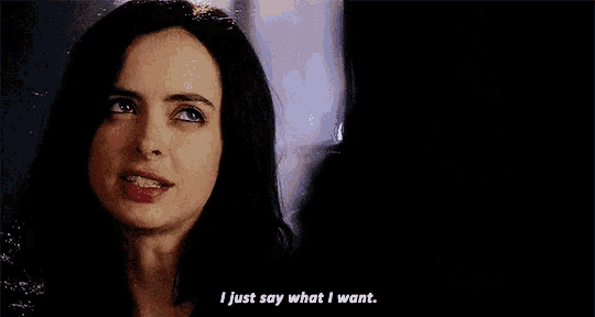 a close up of a woman 's face with the words `` i just say what i want '' written below her .
