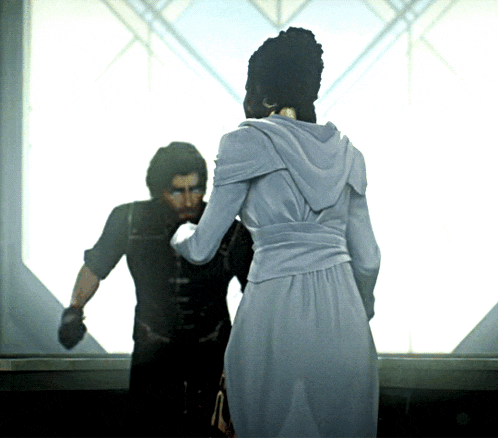 a woman in a white dress is standing next to a man in a black shirt