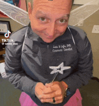 a man is dressed as a cosmetic dentist