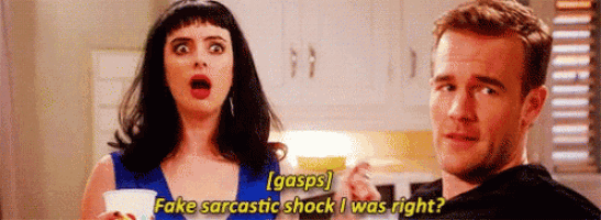 a man and a woman are standing next to each other in a kitchen and the woman is saying `` gasps '' .