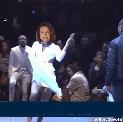 a woman is dancing in front of a crowd with the word nancy written on the bottom