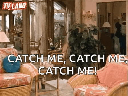a living room with wicker furniture and a sign that says catch me