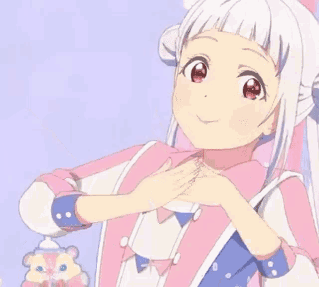 a girl with white hair and red eyes is making a peace sign with her hand .