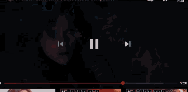 a close up of a person in a dark room with a glowing light coming out of their chest .