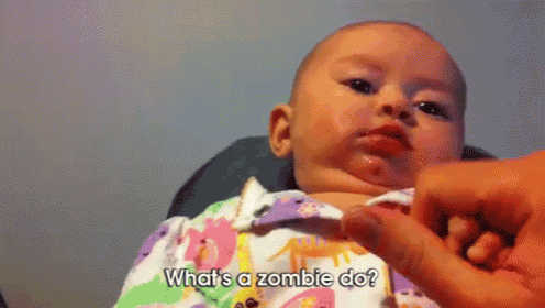 a baby is being held by a person and asking what 's a zombie do ?