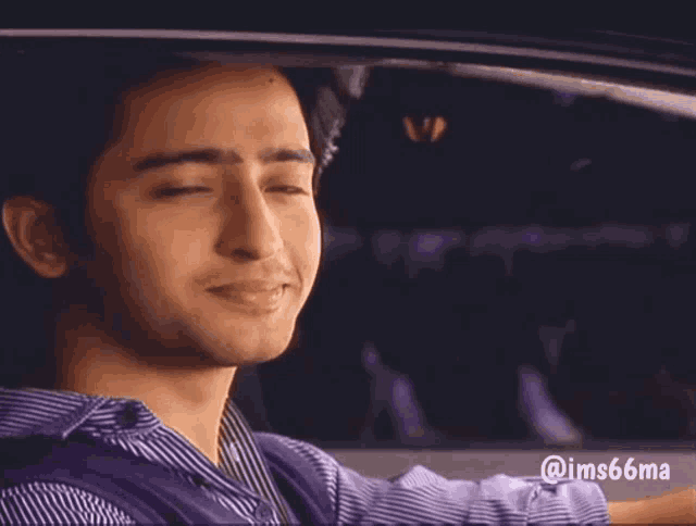 a man in a striped shirt is smiling in a car with @ims66ma written on the bottom