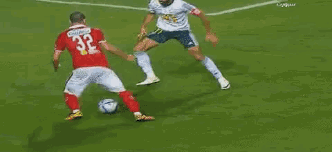 a blurry picture of a soccer game with a player wearing a jersey that says ' a ' on it