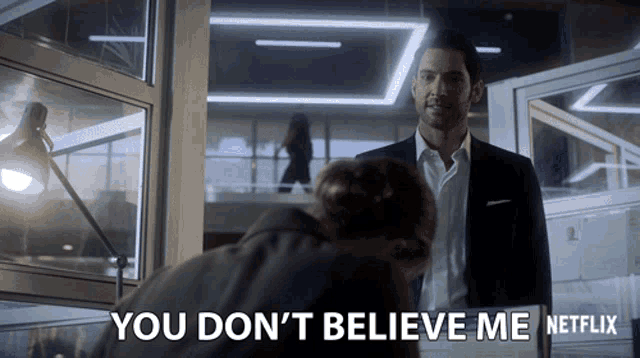 a man in a suit stands next to a woman and says you do n't believe me netflix