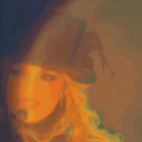a blurry picture of a woman wearing a hat