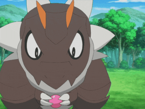 a cartoon character with horns is holding a pink heart in its mouth