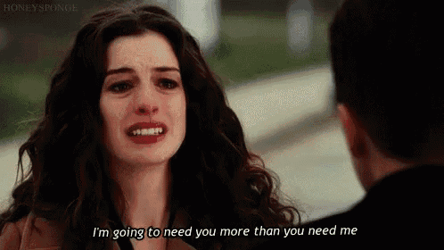 a woman is crying and talking to a man who is standing next to her .