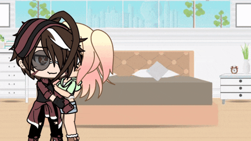 a boy and a girl are hugging in front of a bed in a bedroom