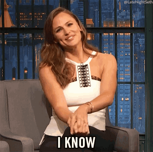 a woman is sitting in a chair with her hands folded and the words i know above her