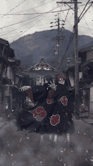 a couple of anime characters with red clouds on their robes