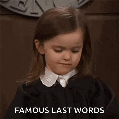 a little girl in a black dress and white collar is making a funny face and says `` famous last words '' .