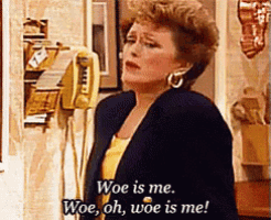 a woman is talking on a telephone and says woe is me woe oh woe is me