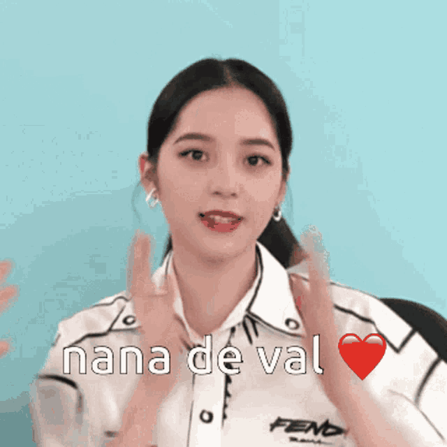 a woman wearing a white shirt with the word nana de val on it