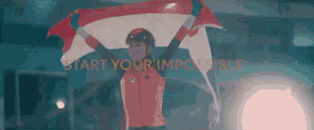 a person holding a flag with the words " start your impossible " in the background