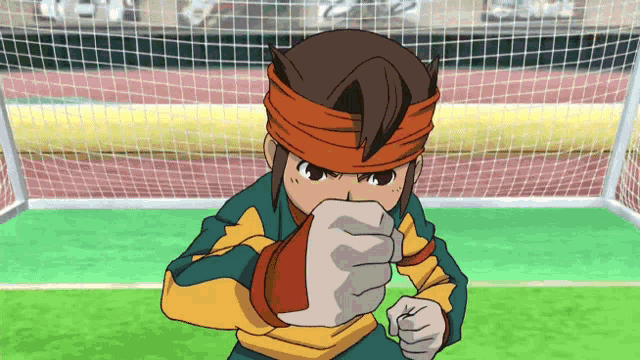 a cartoon character with a bandana on his head is pointing his fist