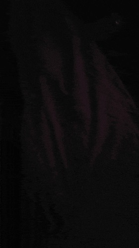 a close up of a person 's arm in the dark