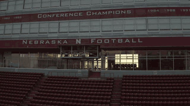 an empty stadium with a sign that says conference champions on it