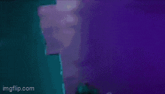a woman is standing in front of a purple background with a bunny icon .