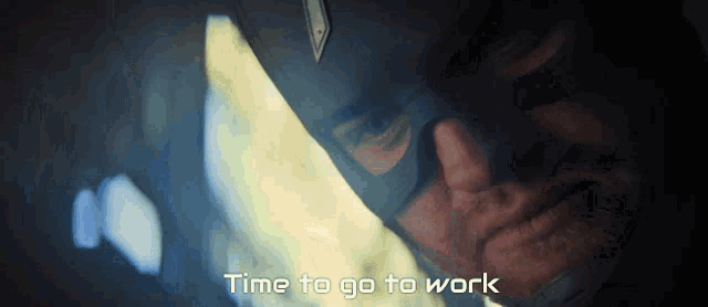 a close up of a man in a mask with the words time to go to work below him