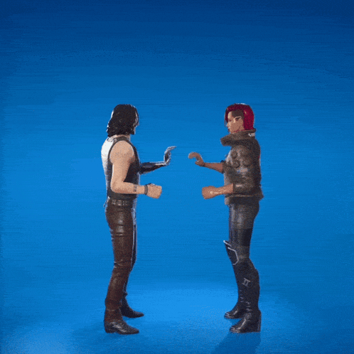 two men are jumping in the air with their arms in the air and one has a tattoo on his arm