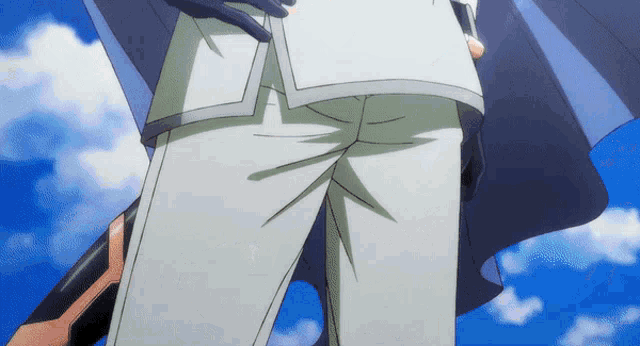 a person 's pants are shown with a blue sky behind them