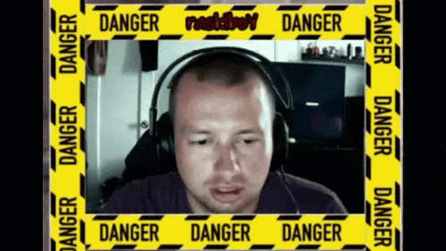 a man wearing headphones is surrounded by a yellow tape that says danger