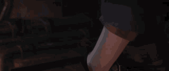 a person is holding a bunch of blue balls in their hands