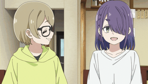 a girl with purple hair and glasses is standing next to another girl