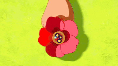 a close up of a person 's face with a red flower on their forehead