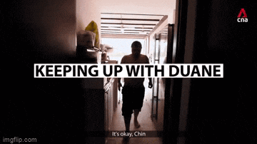 a shirtless man is standing in a doorway with the words keeping up with duane written above him