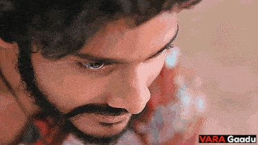 a close up of a man 's face with the words vara gaadu below