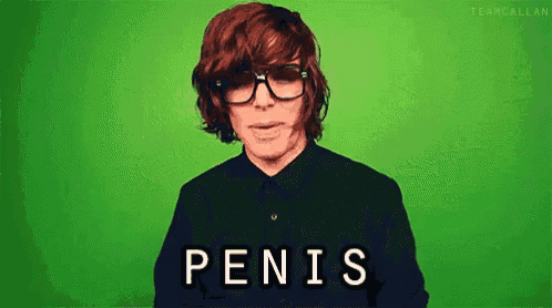 a man wearing glasses and a black shirt says penis on a green screen .