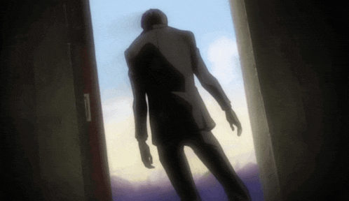 a man in a suit is standing in a doorway looking out