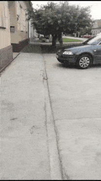 a car is parked on the side of the road and has a license plate that says ' tf ' on it