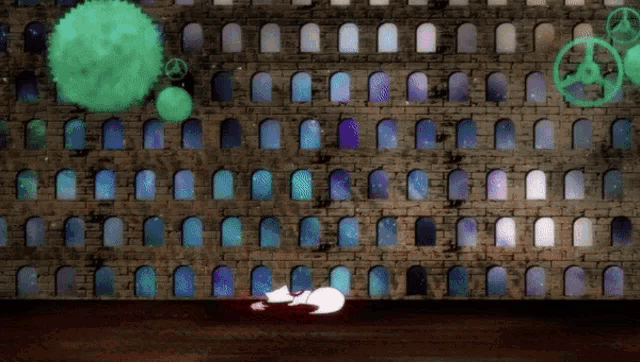 a brick wall with a bunch of windows and a green circle
