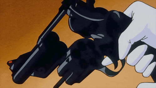 a person is holding a black gun with a red dot on the front